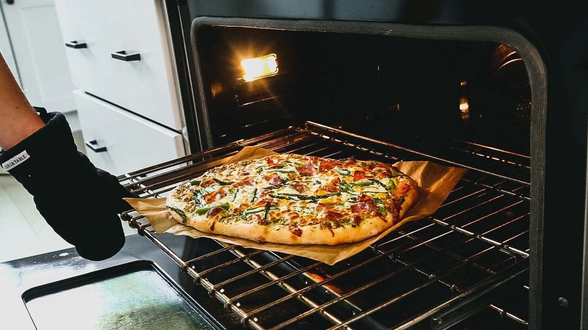 the baked pizza on the oven rack