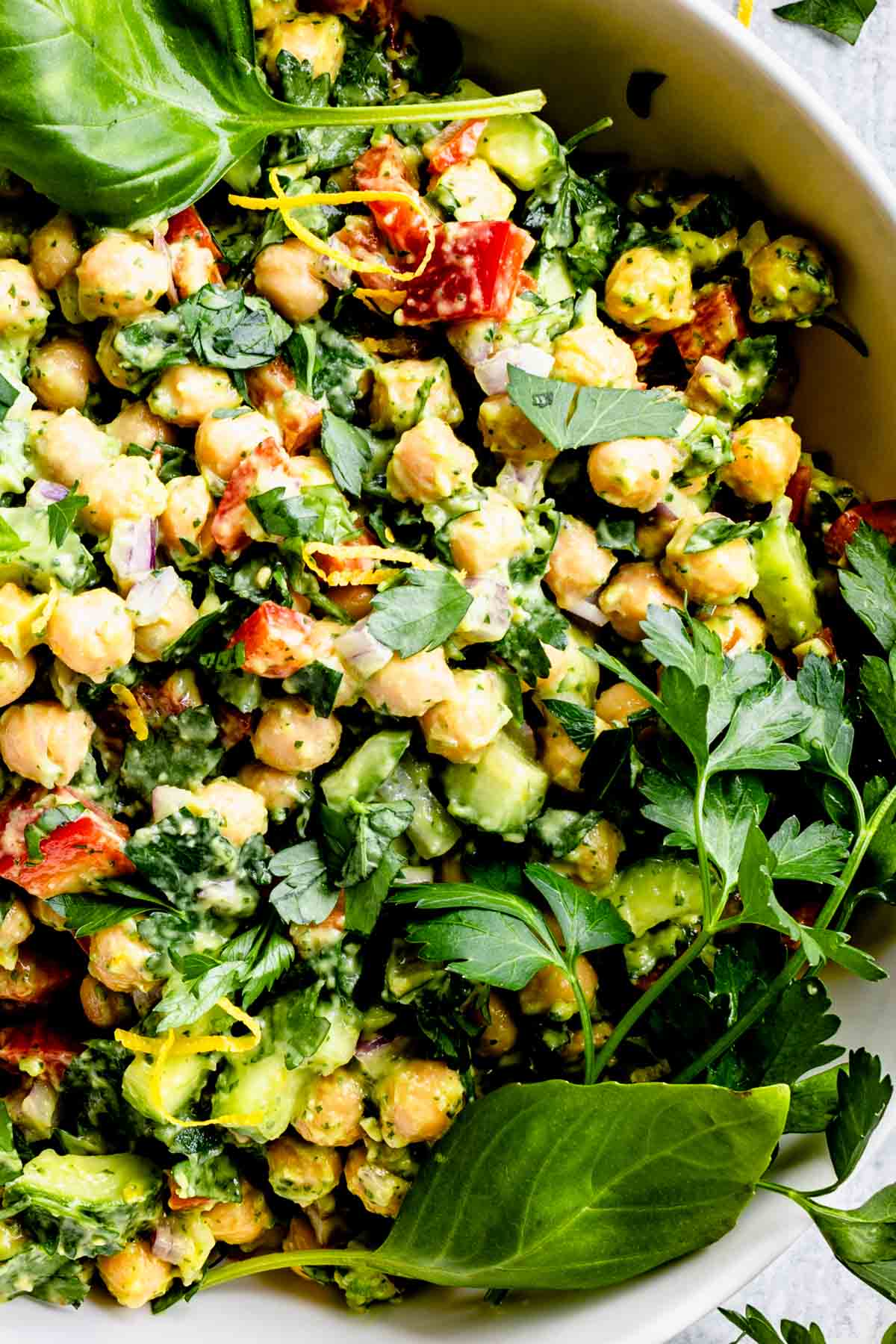creamy chickpeas with herbs and red pepper closeup