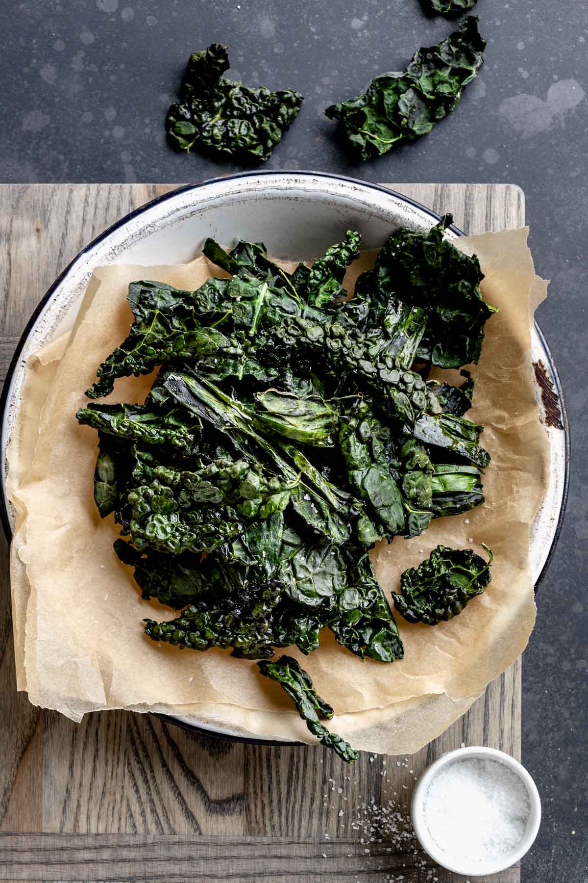 Kale Chips in a metal pie tin with parchment