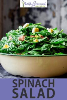 spinach salad with bacon and eggs text overlay