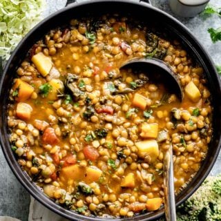 Lentil soup close up in a black pot