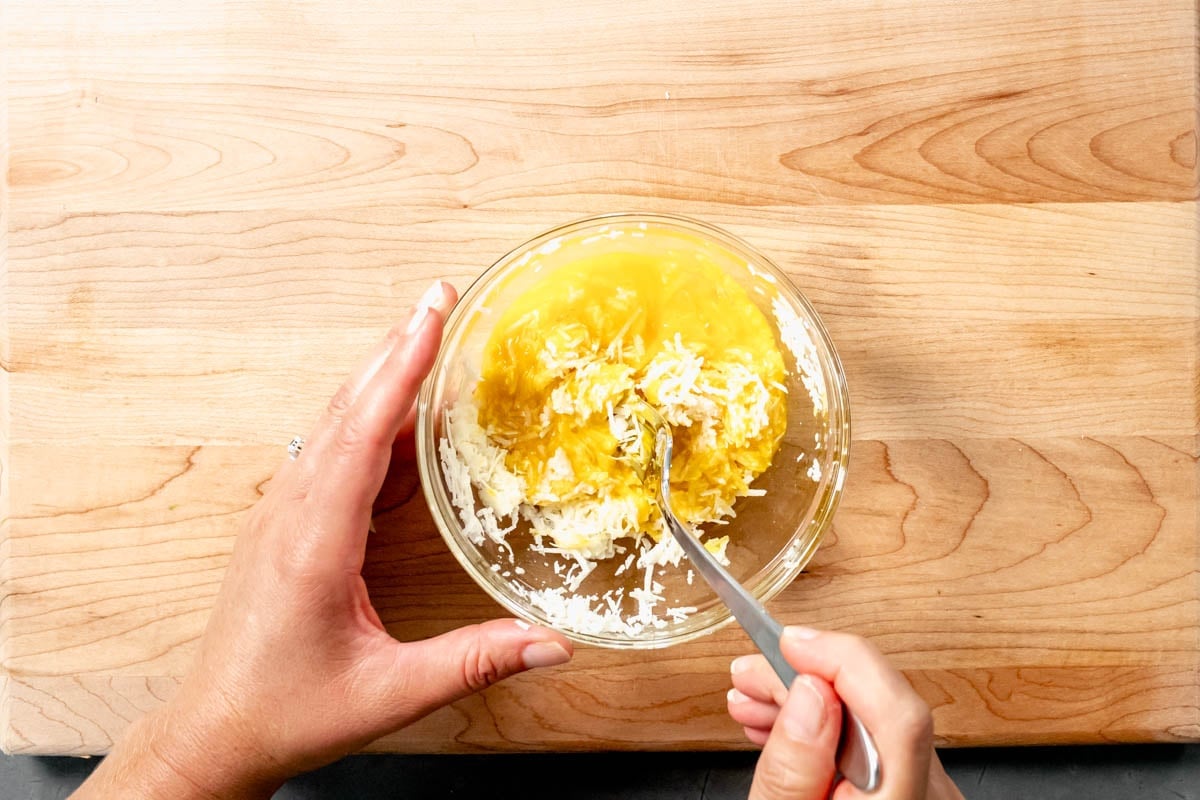 whisking the cheese and egg together