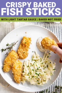 fish sticks on a white plate with someone dunking one into tartar