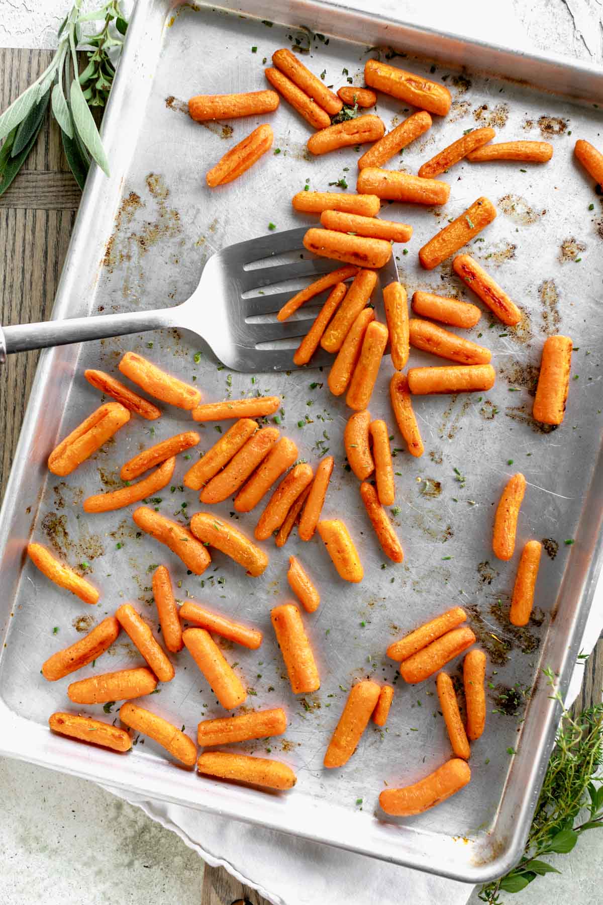 a sheet pan with the roasted carrots on it