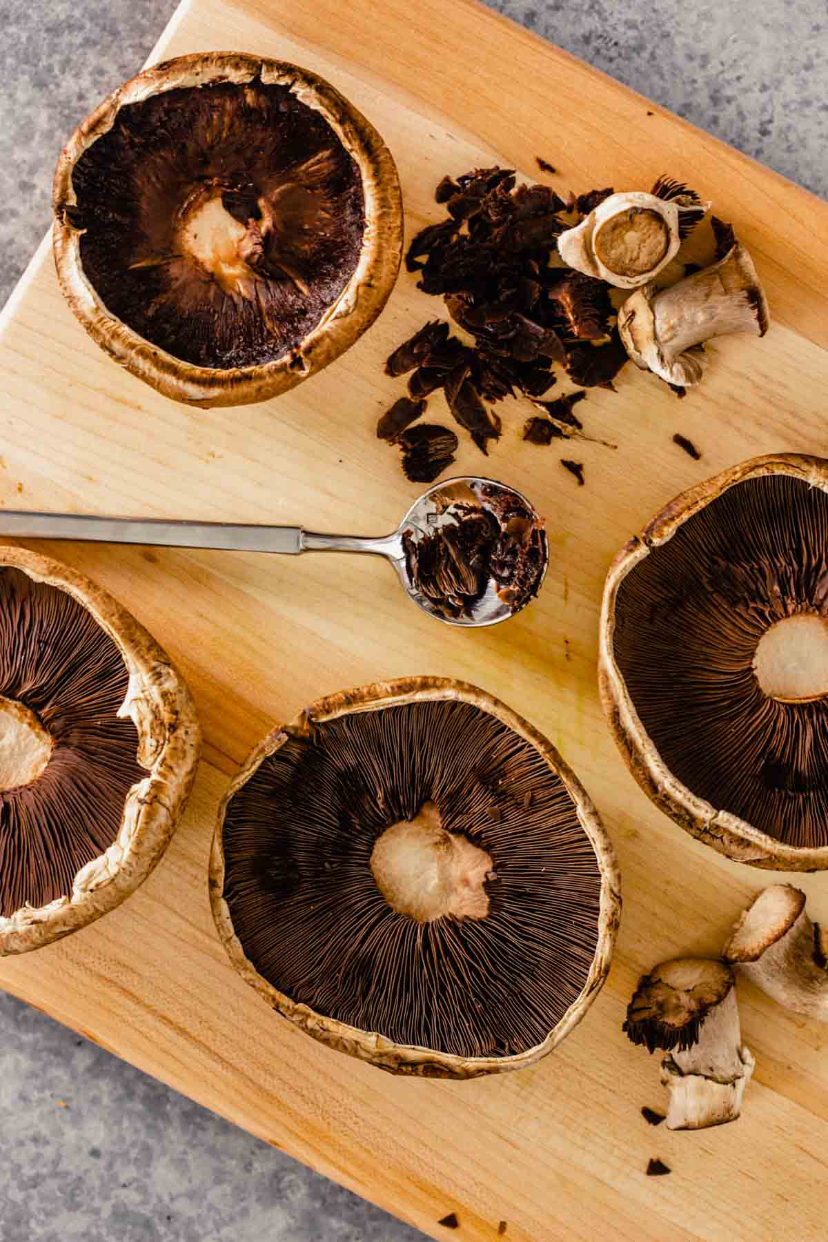 portobello mushrooms on a wood cutting board