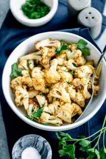 air fried cauliflower in circular white serving bowl