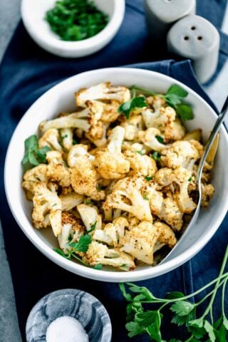 air fried cauliflower in circular white serving bowl