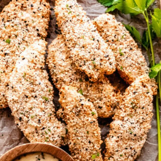 crispy air fryer chicken cutlets in a dish with brown parchment