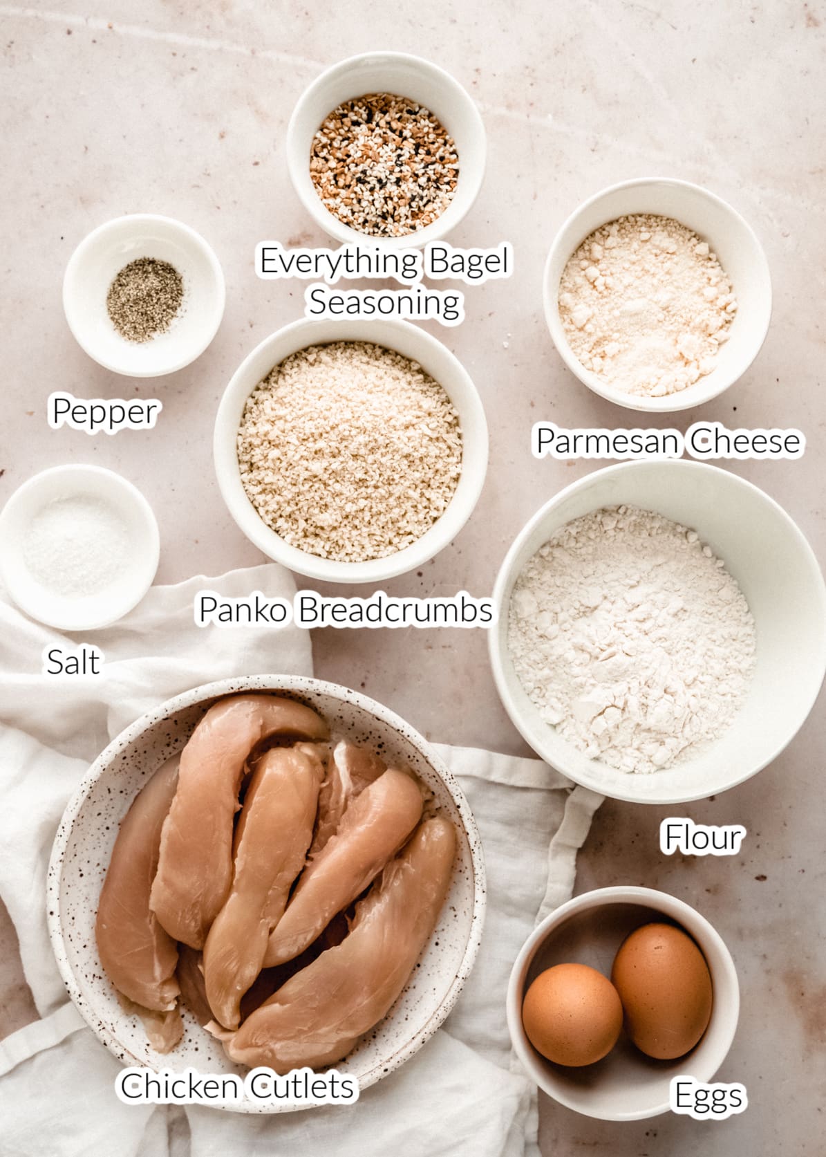 Ingredients to make Air Fryer Chicken cutlets in bowls on countertop