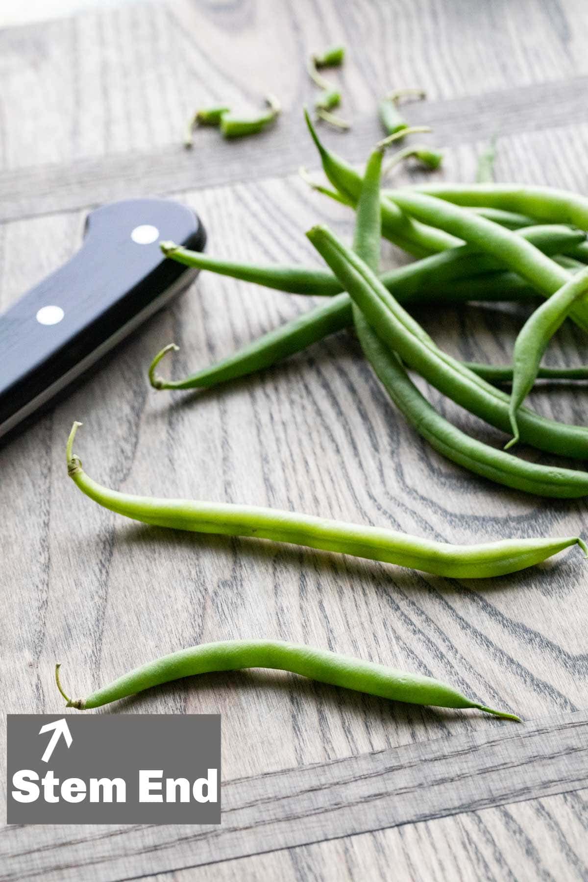 image showing the stem end of the green bean with text overlay