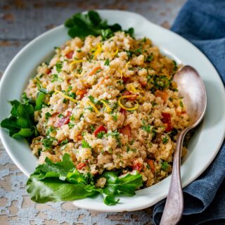 sherry orange quinoa in an aqua dish