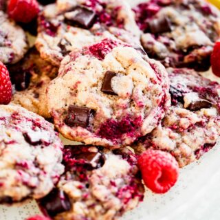 close up of stacked raspberry chocolate chunk cookies