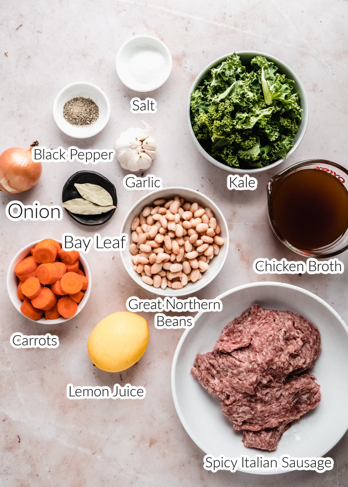 Sausage and Kale soup ingredients in bowls on countertop