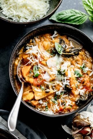 Close up of tuscan ribollita in bowl with spoon