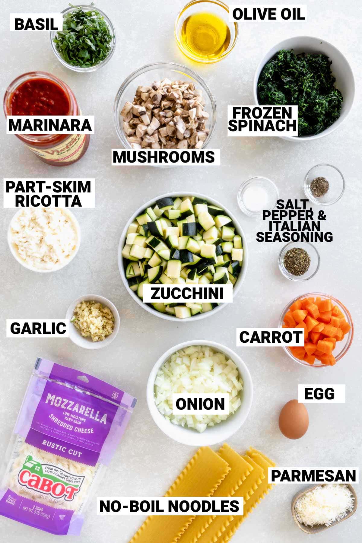 Easy baked vegetable lasagna ingredients on white counter with text overlay