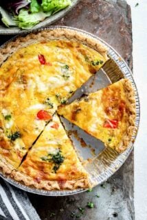 overhead photo of healthy quiche with triangular slices cut into the pie.