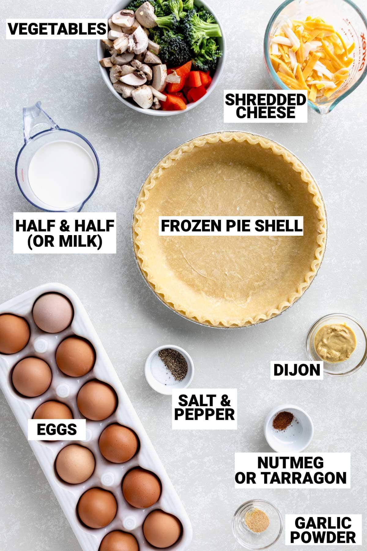 ingredients for healthy vegetable quiche on white counter with text overlay