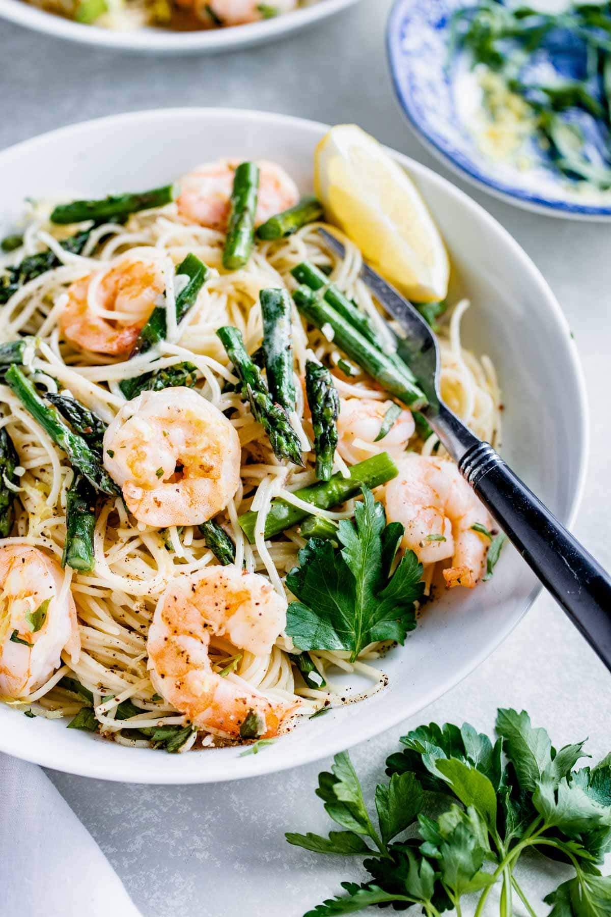 the pasta with a lemon wedge