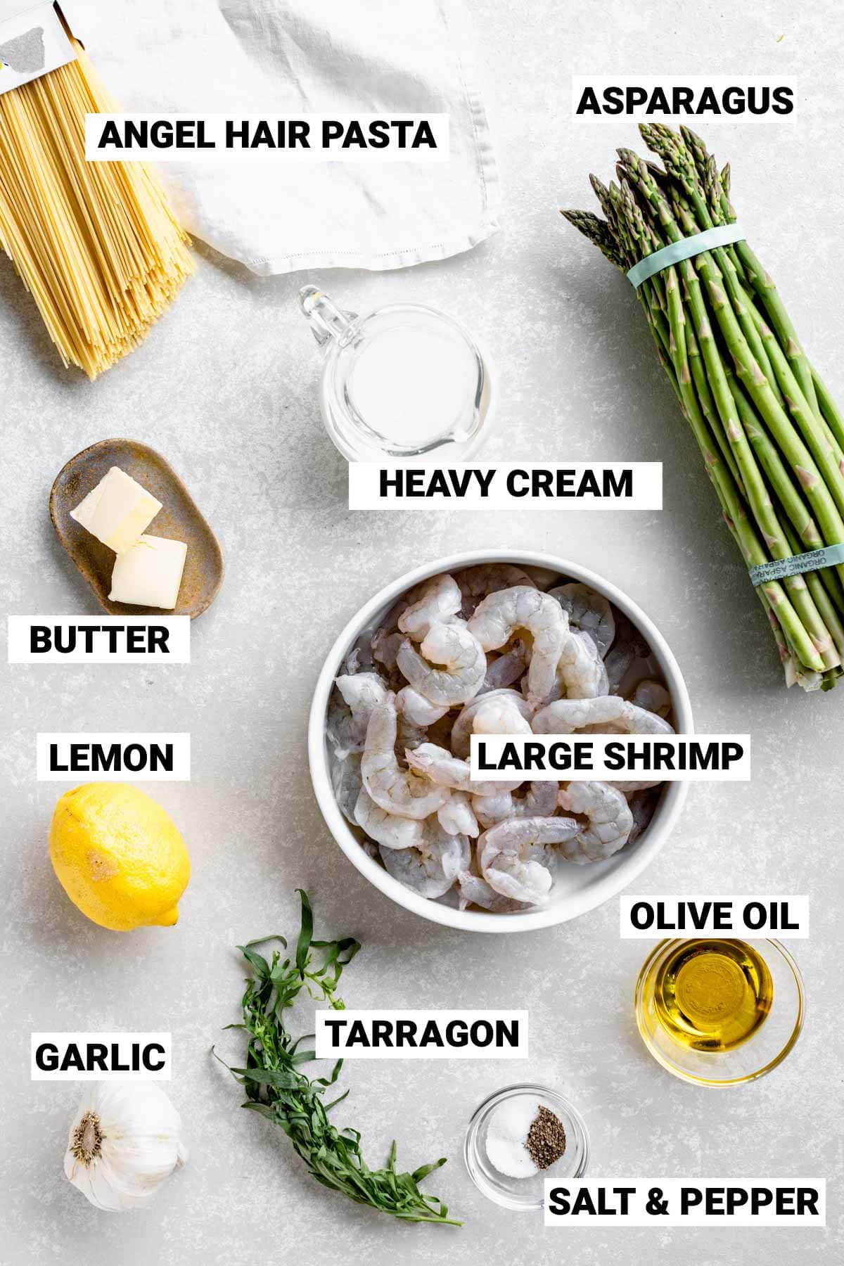 the shrimp and asparagus with the other ingredients on a table with text overlay labels