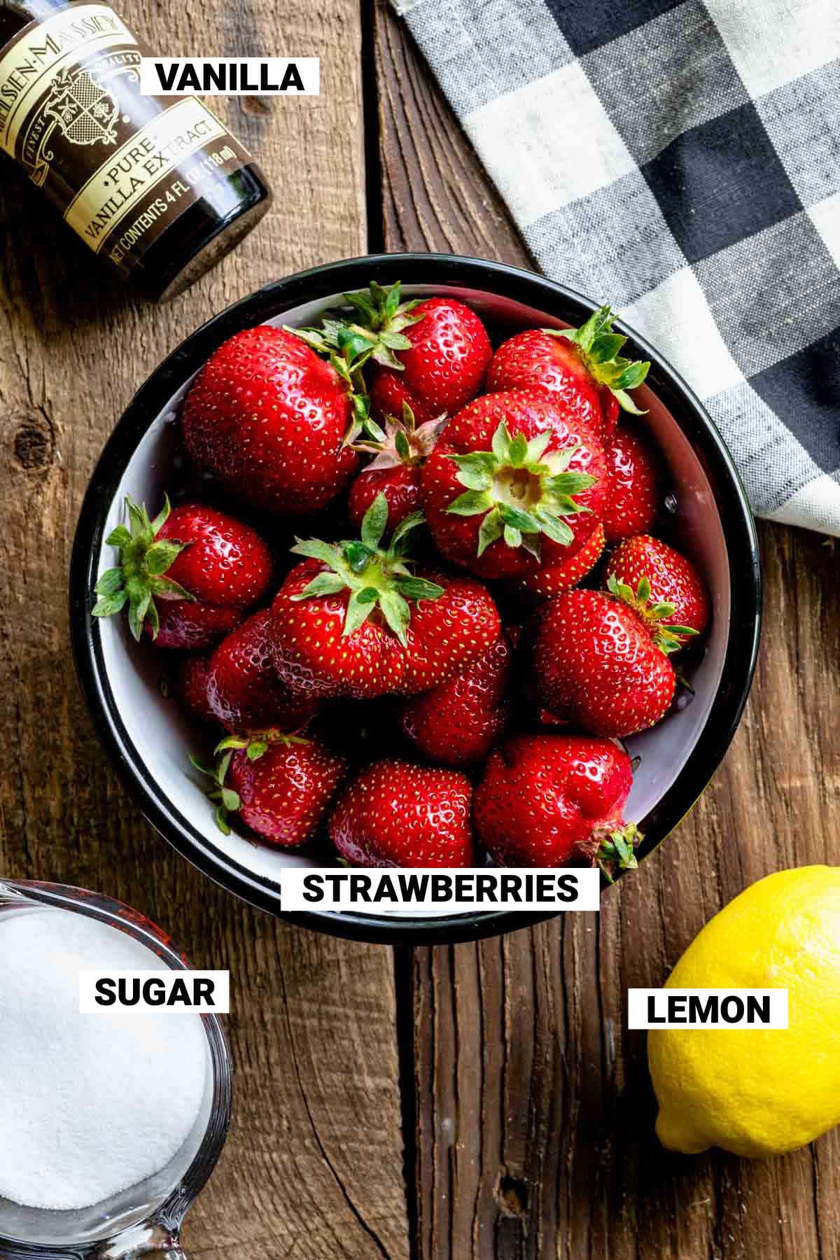 strawberries, lemon, sugar and vanilla with text overlay