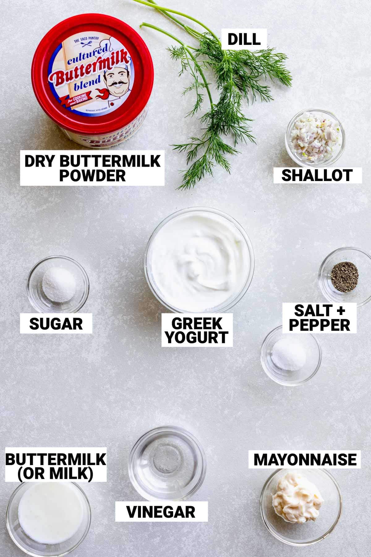 ingredients for the dressing on a white table with labels