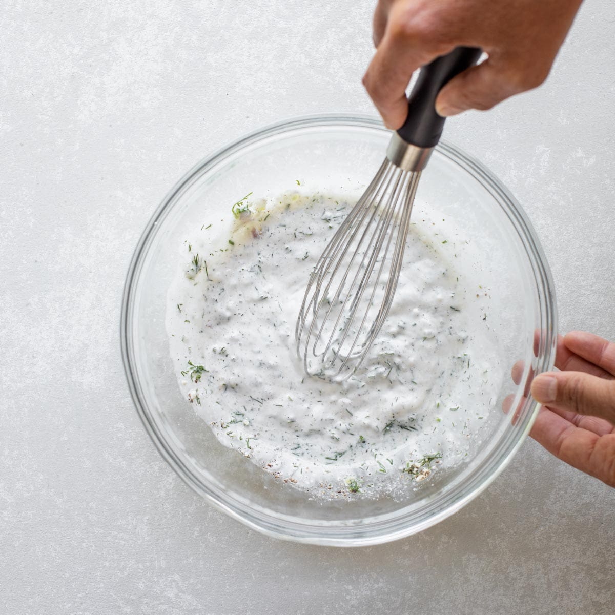 whisking the dressing together