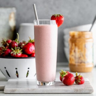 a smoothie with a metal straw