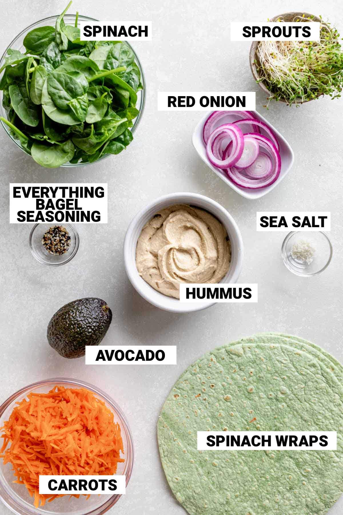 spinach wraps, veggies and other ingredients on a white table with text overlay