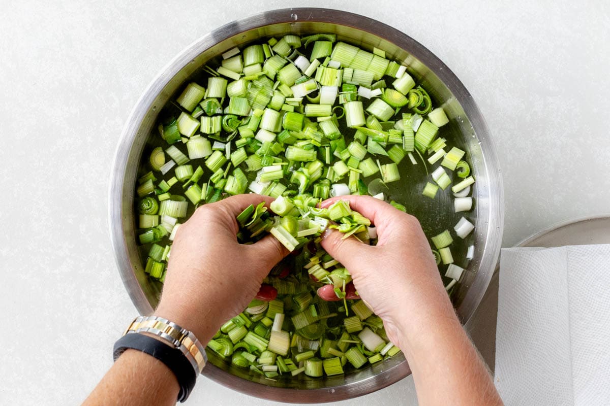 washing the leeks in a bowl of water