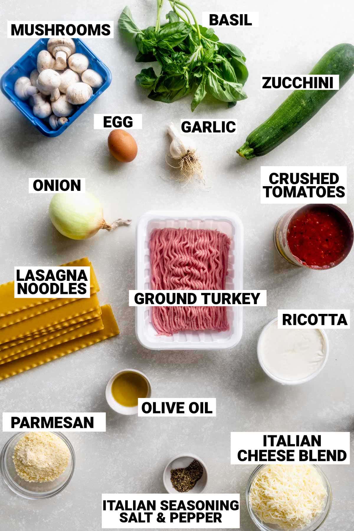 the ingredients for the lasagna with text overlay on a white table
