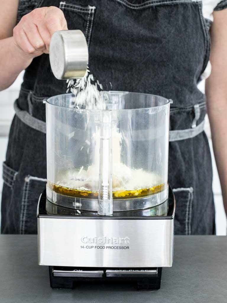 adding the cheese to the dressing