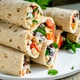 a stack of lavash wraps on a white platter