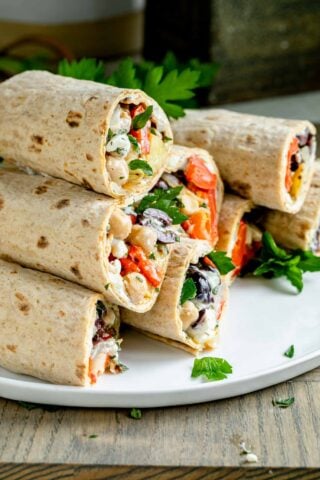 a stack of lavash wraps on a white platter