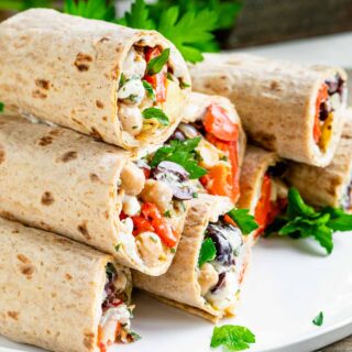 a stack of wraps with parsley garnish