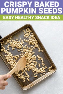 Sheet pan of roasted pumpkin seeds with text overlay
