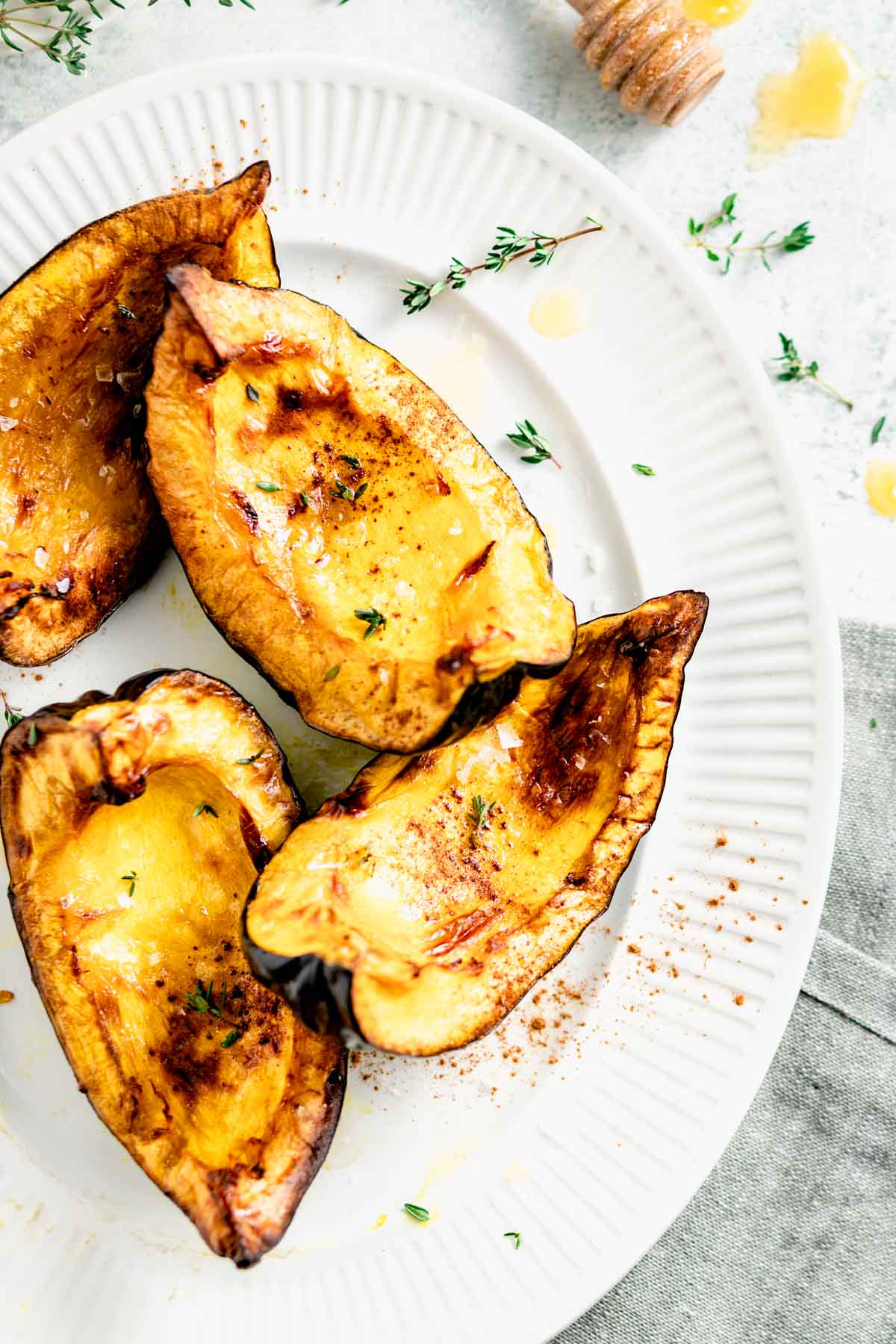 acorn squash made in the air fryer, glazed with honey, and sprinkled with cinnamon