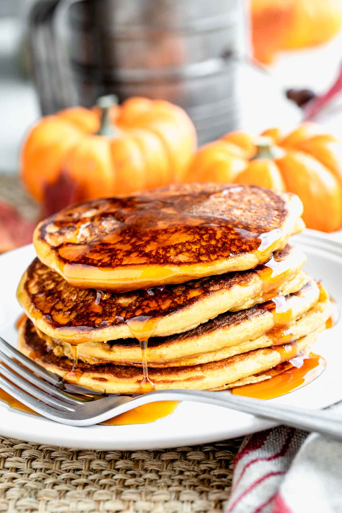 a stack of pancakes with syrup on it