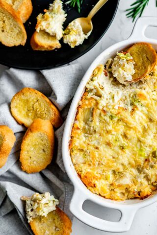 overhead angle of the dip with a scoop take out and crostini
