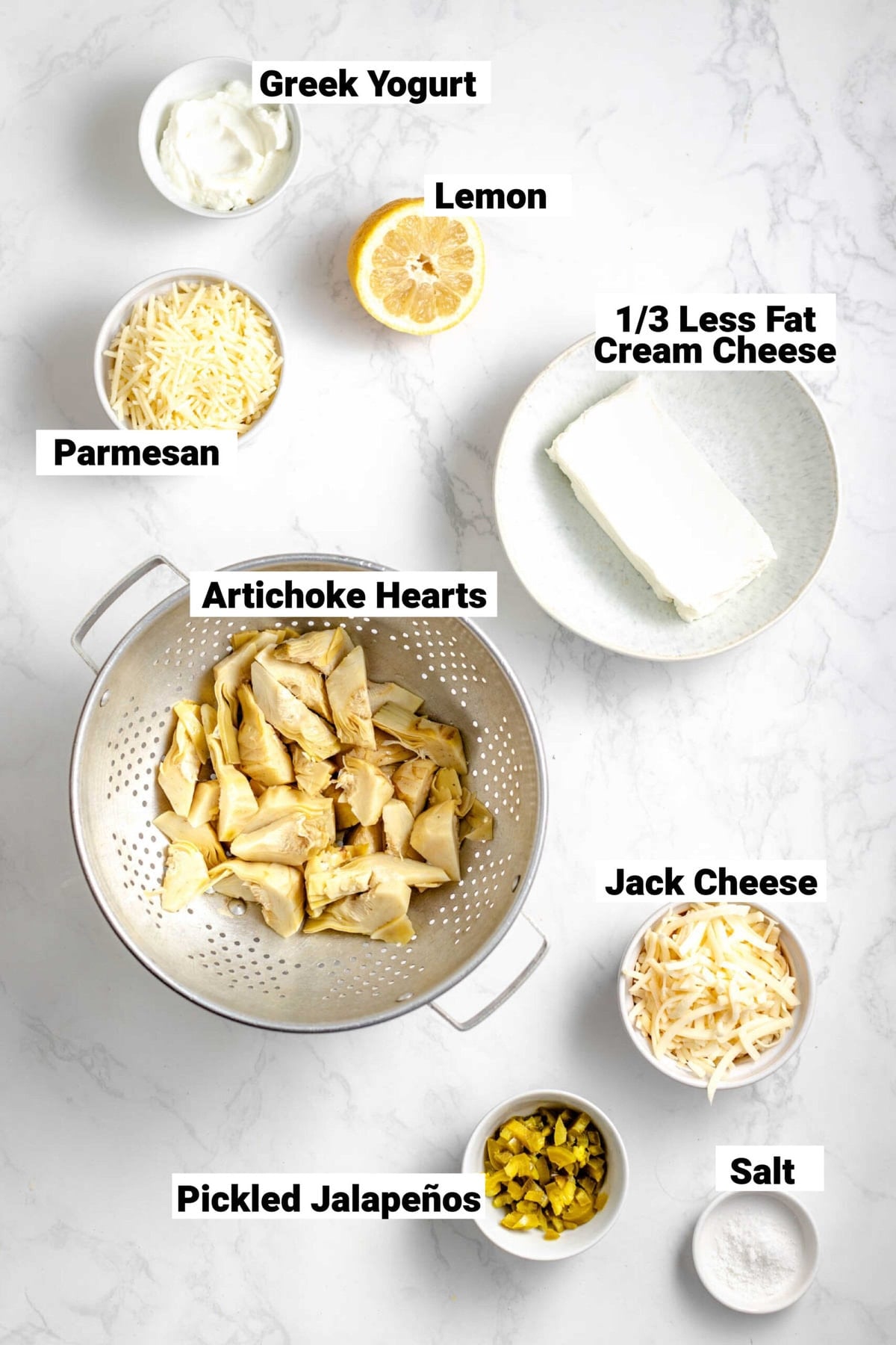 the ingredients with labels on a white table