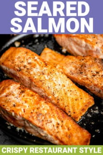 seared salmon in a black pan