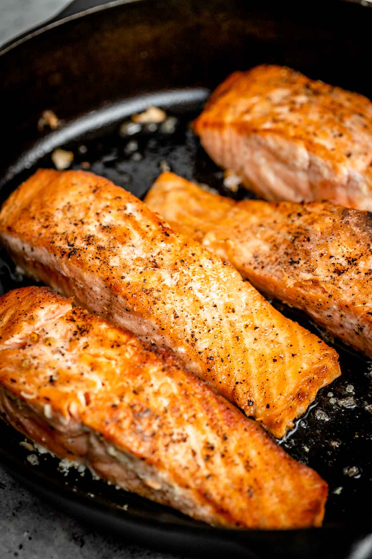 the seared salmon in the skillet