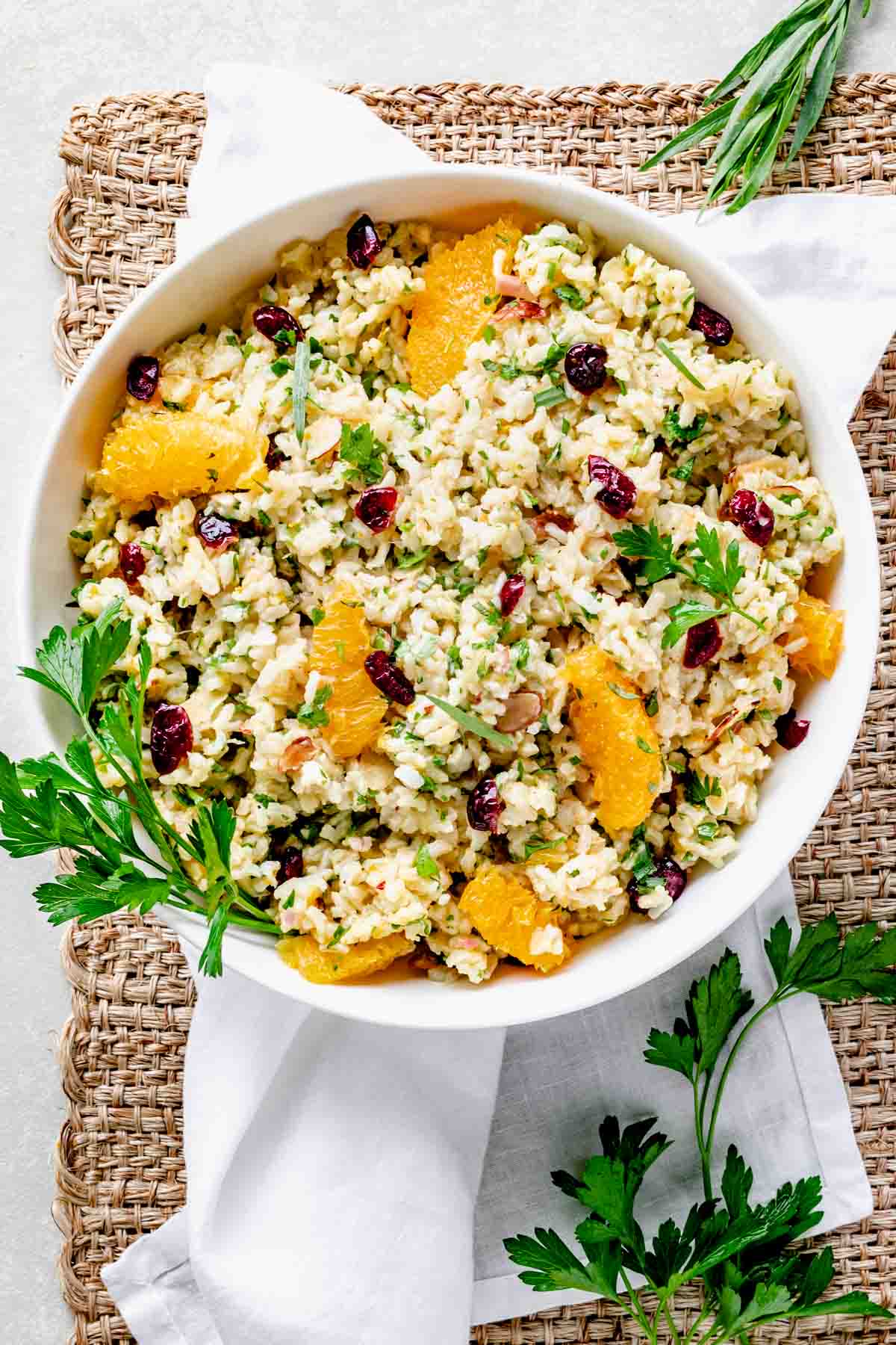 overhead photo of a bowl of healthy brown rice salad with cranberries