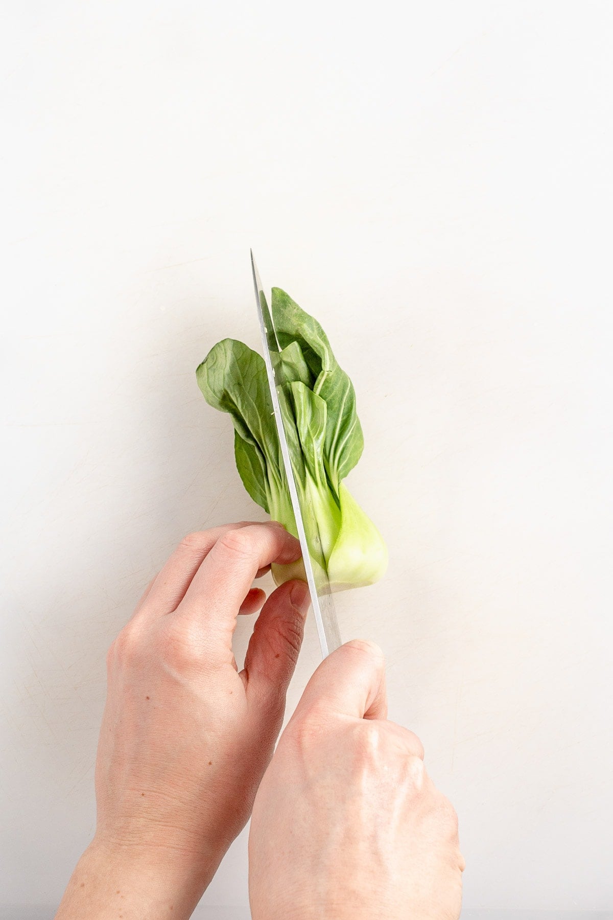 cut baby bok choy in half