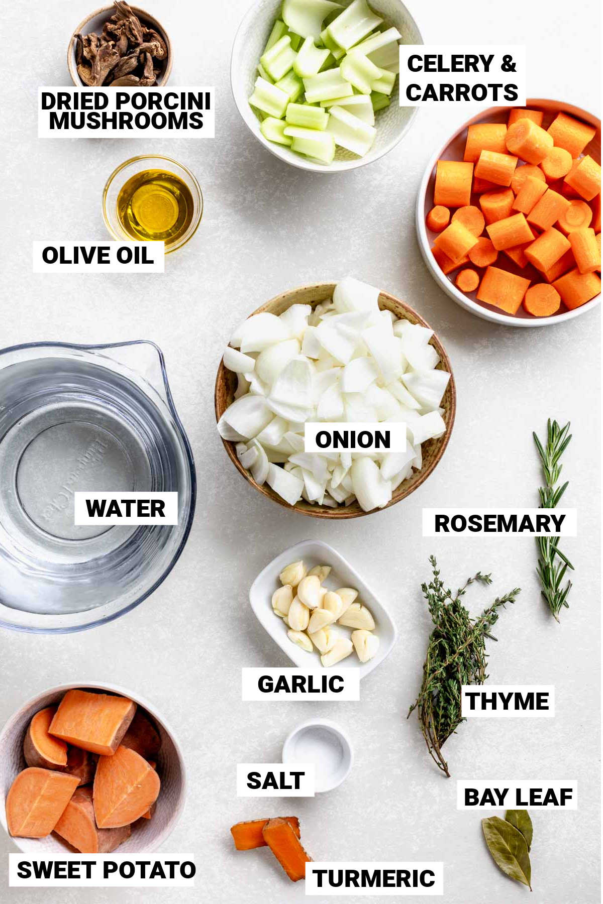 ingredients for vegetable stock organized into individual bowls