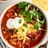 the turkey chili in a white bowl from overhead