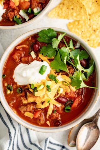 the turkey chili in a white bowl from overhead