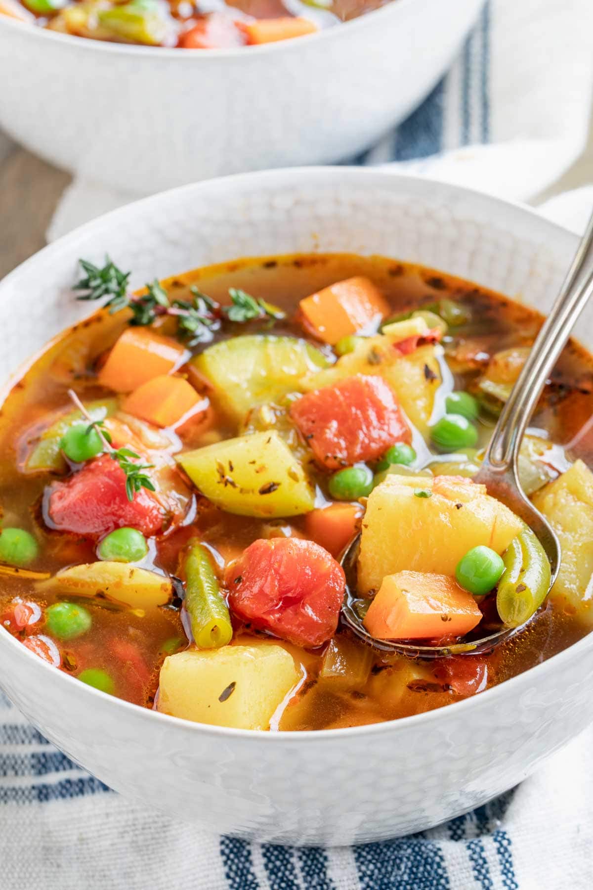 a bowl of the soup with a spoonful