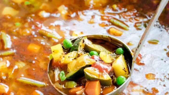 a blue pot with soup in it, and a ladle lifting a scoopful out