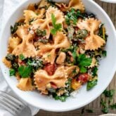 a serving of the swiss chard and farfalle pasta in a white bowl