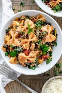 a serving of the swiss chard and farfalle pasta in a white bowl